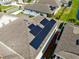 Aerial view of house with solar panels on the roof at 2275 Cathedral Rock Dr, Kissimmee, FL 34746