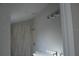 Bright bathroom featuring a tiled shower and modern vanity at 575 2Nd St, Oviedo, FL 32765