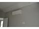 Bedroom with modern air conditioning unit and freshly painted walls at 575 2Nd St, Oviedo, FL 32765