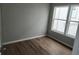 Bedroom features modern flooring and large window for natural light at 575 2Nd St, Oviedo, FL 32765
