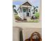 Charming tiny home with a covered front porch, offering a cozy and inviting curb appeal at 575 2Nd St, Oviedo, FL 32765