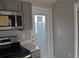 Up-close kitchen with modern stainless steel appliances, gray cabinetry, and convenient countertop space at 575 2Nd St, Oviedo, FL 32765