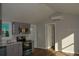 Bright kitchen with stainless steel appliances and gray cabinetry, featuring a comfortable cooking space at 575 2Nd St, Oviedo, FL 32765