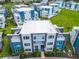 Modern building with multiple units and surrounding green space at 7770 Sandy Ridge Dr # 18-129, Reunion, FL 34747