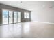 Bright living room with sliding doors to patio at 7770 Sandy Ridge Dr # 18-129, Reunion, FL 34747