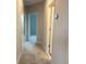 Hallway with gray carpeting and bedroom doors at 9279 Gran Teatro Dr, Winter Garden, FL 34787