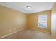 Simple bedroom with yellow walls and carpet at 11757 Fitzgerald Butler Rd, Orlando, FL 32836