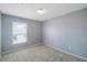 Bright bedroom with gray walls and carpet at 11757 Fitzgerald Butler Rd, Orlando, FL 32836