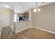 Dining area with hardwood floors and kitchen access at 11757 Fitzgerald Butler Rd, Orlando, FL 32836