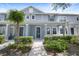 Two-story townhome with light blue exterior and front porch at 11757 Fitzgerald Butler Rd, Orlando, FL 32836