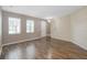 Bright living room with hardwood floors and neutral walls at 11757 Fitzgerald Butler Rd, Orlando, FL 32836