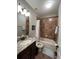 Clean bathroom with tub shower combo and granite countertop vanity at 1366 Ponce Dr, Celebration, FL 34747