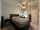 Comfortable bedroom with double bed, ceiling fan and hardwood floors at 1366 Ponce Dr, Celebration, FL 34747