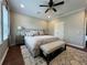 King-size bed, ceiling fan, and plush carpet in spacious main bedroom at 1366 Ponce Dr, Celebration, FL 34747