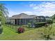 Aerial view of home with fenced backyard and screened pool at 143 Brunswick Dr, Davenport, FL 33837