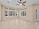 Bright, open living area showcasing tile flooring and large windows for ample natural light at 143 Brunswick Dr, Davenport, FL 33837