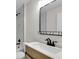 Bathroom with light wood vanity, white countertop and black matte fixtures at Tbd Kilgore St, Wildwood, FL 34785