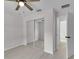 Bright bedroom with mirrored closet doors and wood-look floors at Tbd Kilgore St, Wildwood, FL 34785