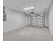 Spacious garage with white walls and automatic door opener at Tbd Kilgore St, Wildwood, FL 34785