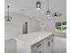 Modern kitchen island with white cabinets and quartz countertops at Tbd Kilgore St, Wildwood, FL 34785