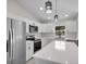 Modern kitchen with stainless steel appliances and white shaker cabinets at Tbd Kilgore St, Wildwood, FL 34785