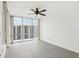 Bright bedroom with tile floors and large window with city views at 322 E Central Blvd # 1711, Orlando, FL 32801