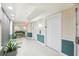 Clean hallway with teal and white color scheme at 322 E Central Blvd # 1711, Orlando, FL 32801