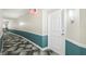 Modern hallway with teal and beige color scheme at 322 E Central Blvd # 1711, Orlando, FL 32801