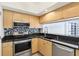 Modern kitchen featuring stainless steel appliances and granite countertops at 322 E Central Blvd # 1711, Orlando, FL 32801