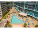 Aerial view of resort-style pool, hot tub, and lounge chairs at 322 E Central Blvd # 1711, Orlando, FL 32801