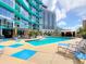 Inviting resort-style pool with lounge chairs and patio seating at 322 E Central Blvd # 1711, Orlando, FL 32801