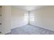 Carpeted bedroom features two windows at 9982 Fiddley Aly, Orlando, FL 32827