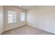 Bedroom with carpet flooring and two windows at 9982 Fiddley Aly, Orlando, FL 32827