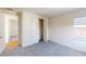 Bedroom with grey carpet, closet, and a window at 9982 Fiddley Aly, Orlando, FL 32827