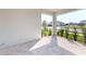 Cozy covered patio with a stone floor offering a relaxing outdoor space with lovely neighborhood views at 9982 Fiddley Aly, Orlando, FL 32827