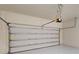 View of an attached, spacious two car garage with an automatic door at 9982 Fiddley Aly, Orlando, FL 32827