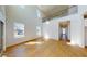 Spacious living room featuring hardwood floors, high ceilings, and large windows with modern blinds at 9982 Fiddley Aly, Orlando, FL 32827