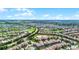 Expansive aerial view of a well-planned community, golf course, and lush landscapes at 1427 Rolling Fairway Dr, Davenport, FL 33896