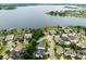 Aerial view of community featuring beautiful lake views, well-maintained landscaping, and charming residential streets at 16695 Broadwater Ave, Winter Garden, FL 34787