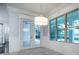 Bright dining room with windows overlooking the pool and water at 16695 Broadwater Ave, Winter Garden, FL 34787