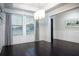 Bright dining room featuring large windows, elegant lighting, and dark wood floors at 16695 Broadwater Ave, Winter Garden, FL 34787