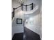 Elegant hallway showcases dark wood floors, wainscoting, and a staircase at 16695 Broadwater Ave, Winter Garden, FL 34787