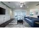 Comfortable living room featuring built-in shelving and sliding doors to the patio at 16695 Broadwater Ave, Winter Garden, FL 34787