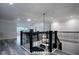 Staircase with iron railings leading to an open-concept living space and a view of the lower level at 16695 Broadwater Ave, Winter Garden, FL 34787