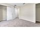 Bright bedroom with grey carpet and double doors to closet at 258 Vizcay Way, Davenport, FL 33837