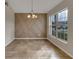 Dining room featuring a geometric accent wall and tile flooring at 258 Vizcay Way, Davenport, FL 33837