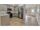 Modern kitchen features stainless steel appliances and light-colored cabinetry at 258 Vizcay Way, Davenport, FL 33837