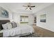 Main bedroom with sliding doors to backyard and ceiling fan at 258 Vizcay Way, Davenport, FL 33837