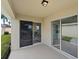 Covered patio with sliding glass doors at 258 Vizcay Way, Davenport, FL 33837