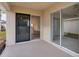 Covered patio with sliding glass doors at 258 Vizcay Way, Davenport, FL 33837